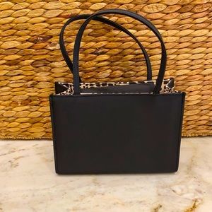 Silky black tote with detachable shoulder strap.